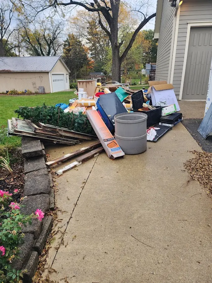 Dumpster being loaded with debris for Residential Dumpster Rental in Whitemarsh Island